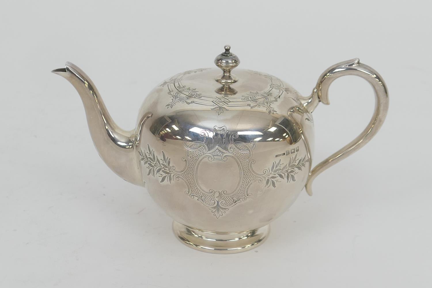 Silver bullet shaped teapot, by S.J.L & Co., Birmingham 1927, finely engraved with vacant