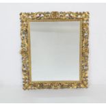 Florentine style carved giltwood wall mirror, the frame carved with acanthus scrolls, late 19th or