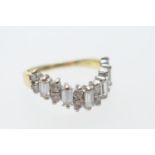 Diamond cluster ring, set with five baguette diamonds dispersed with six pairs of small round cut