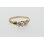 Diamond three stone ring, set with three old cushion cut stones totalling approx. 0.6ct, in claw