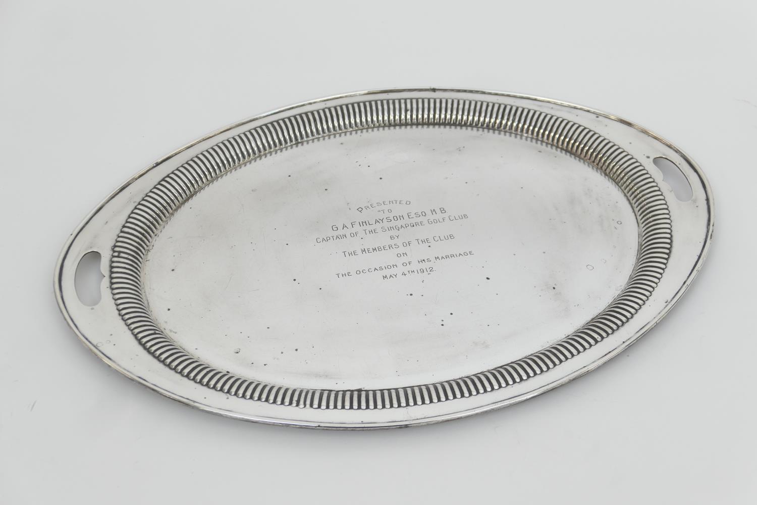 George V silver presentation serving tray, by Barker Bros., Chester 1911, oval form with reeded