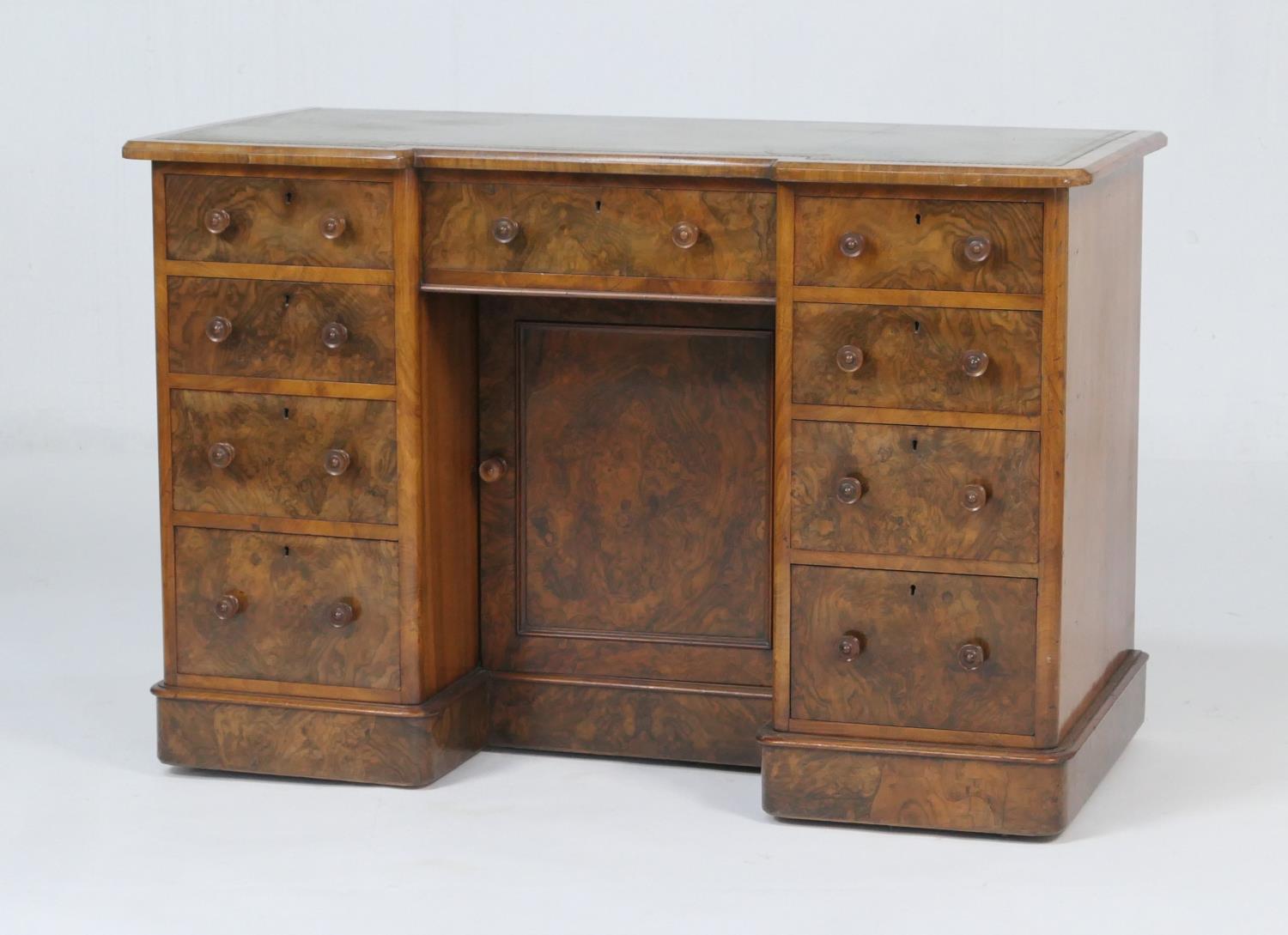 Victorian burr walnut kneehole desk, with inverted breakfront top with gilt tooled leather surface