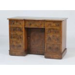 Victorian burr walnut kneehole desk, with inverted breakfront top with gilt tooled leather surface