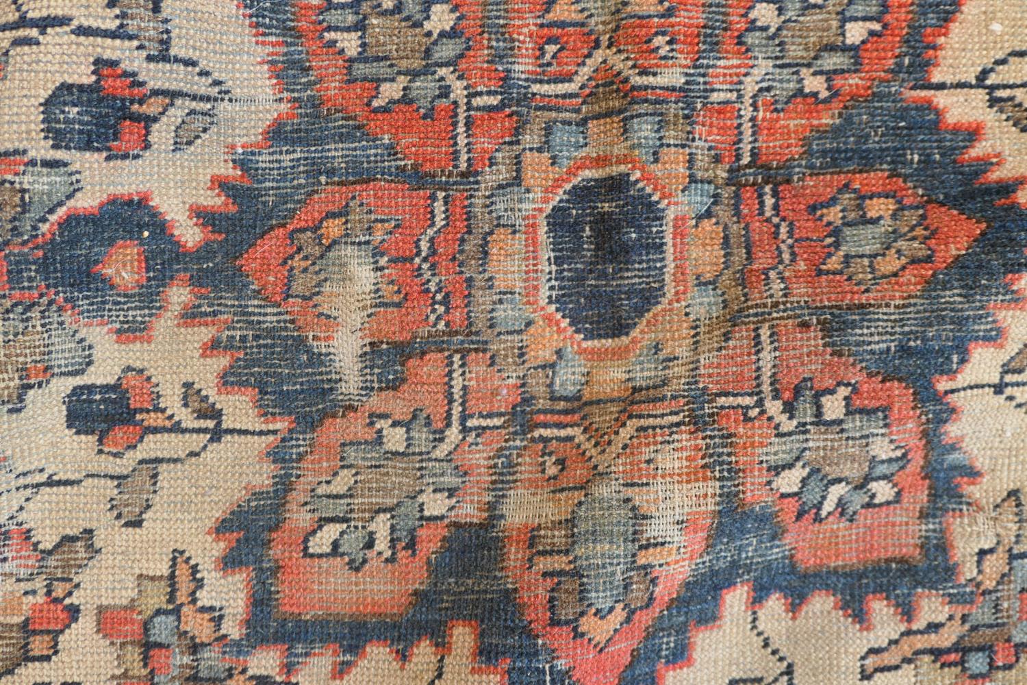 Persian Malayer woollen rug, late 19th Century, centred with a red flowerhead motif within a fawn - Image 6 of 9