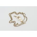 9ct gold chain necklace, supporting a 9ct gold revolver pendant, the necklace 42.5cm, the pendant