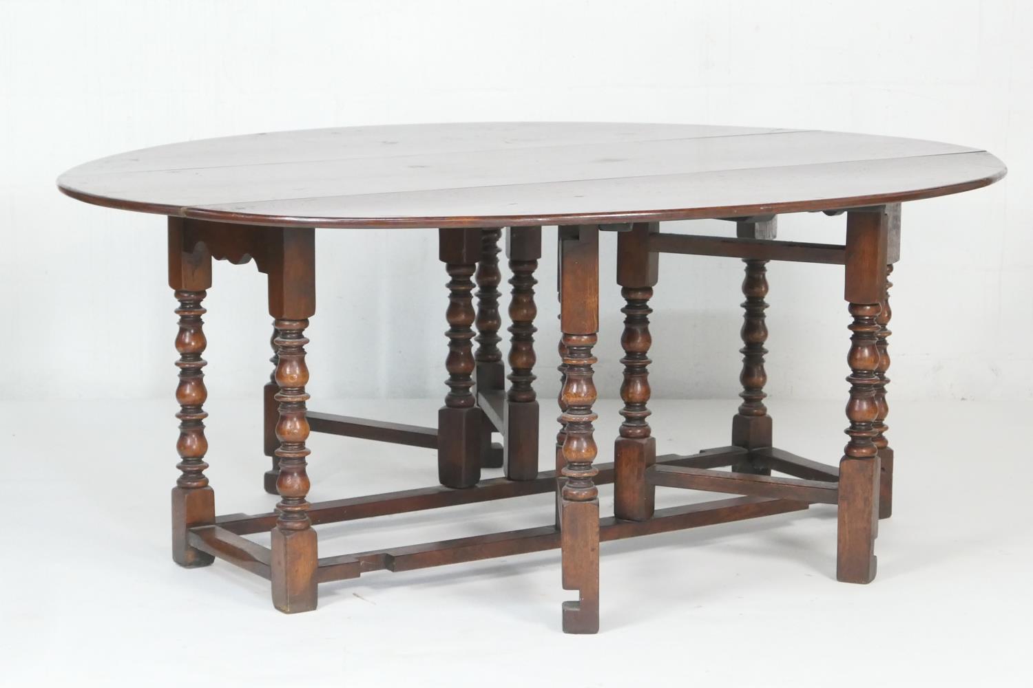 Quality large oak gateleg table in 18th Century style, the oval top with drop leaves supported on - Image 2 of 3