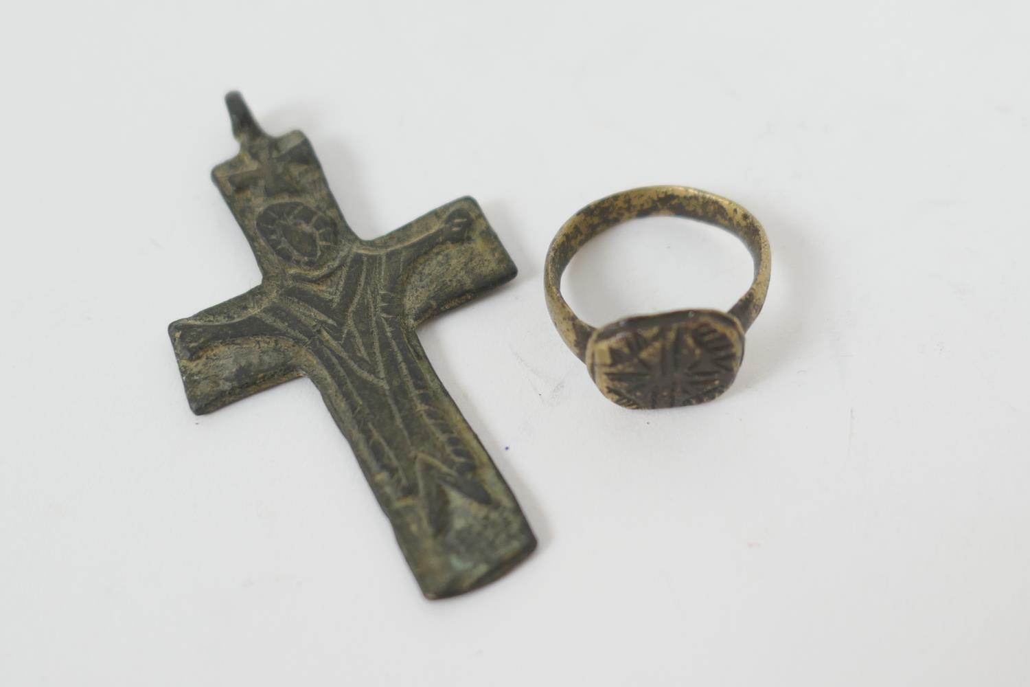 Medieval pilgrim crucifix metal pendant, 6cm x 3.5cm; also a Tudor brass seal ring (2) (Please