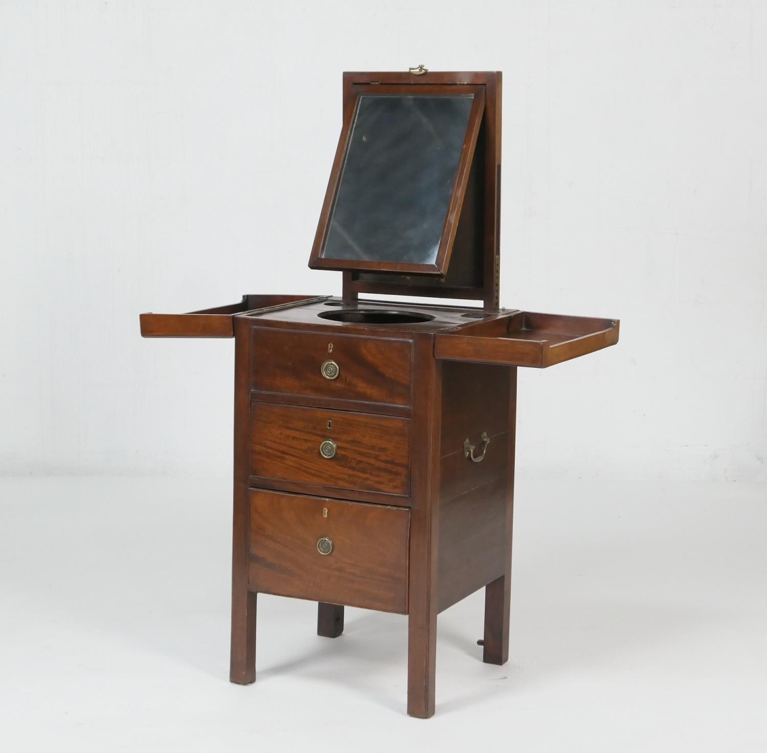 George III gentleman's mahogany washstand, the folding top opening to an interior with wells and a