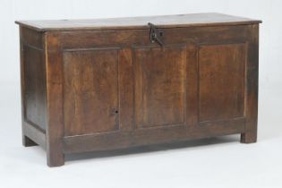 Oak joined coffer, 18th Century, the two plank top over a three recessed panel front, raised on