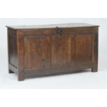 Oak joined coffer, 18th Century, the two plank top over a three recessed panel front, raised on