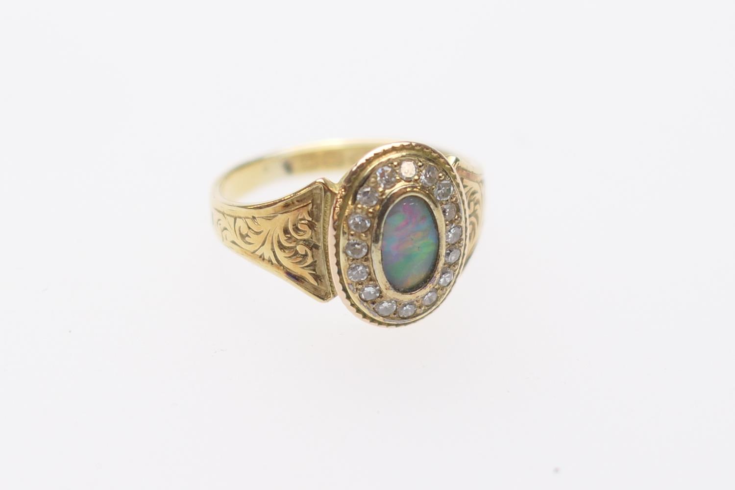 Edwardian opal and diamond memorial cluster ring in 15ct gold, the opal approx. 7mm x 4mm,