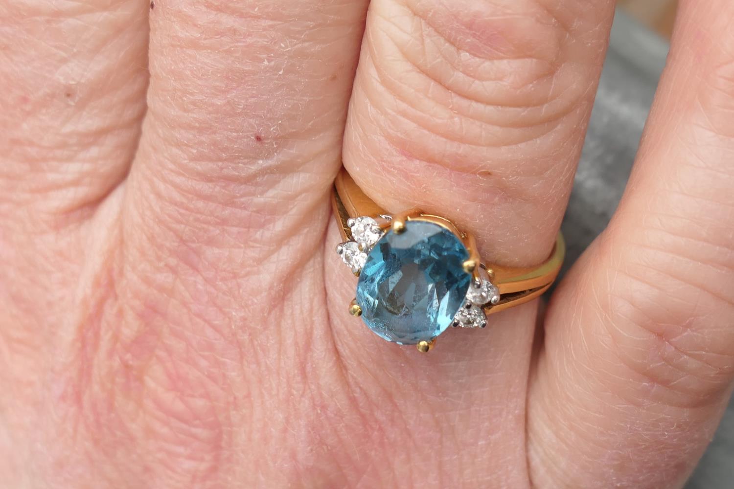 Diamond and blue zircon dress ring, the central oval cut stone of approx. 3cts, bordered with four - Image 5 of 7