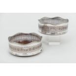 Pair of Elizabeth II silver wine coasters, Sheffield 1991, each with turned wooden bases centred