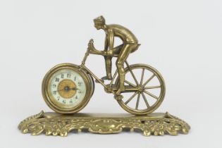 British United Clock Company racing bicycle clock, circa 1910, the clock with Arabic numerals,