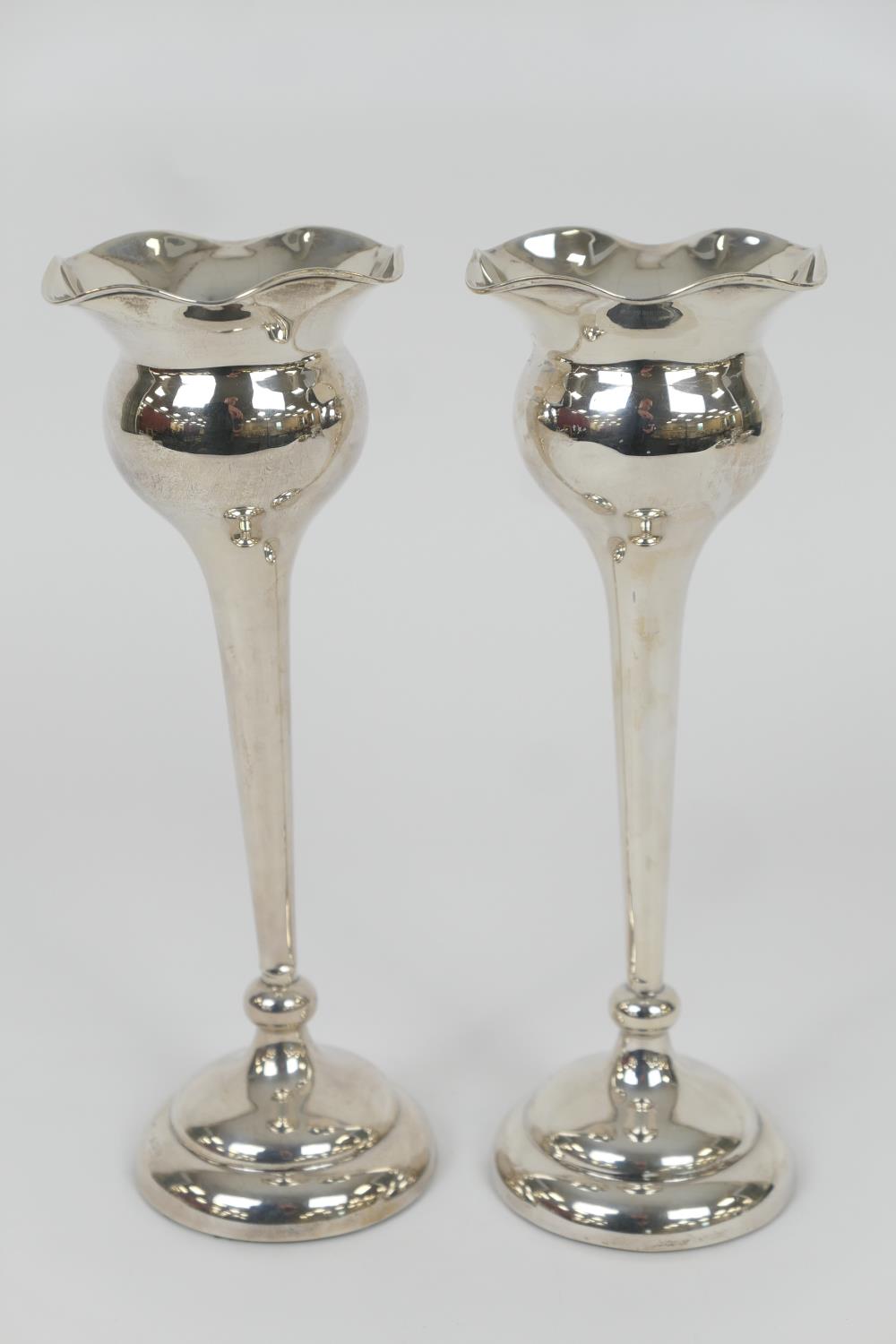 Pair of George V silver 'tulip' vases, Birmingham 1921, flared bulb form with tapered stem,