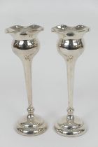 Pair of George V silver 'tulip' vases, Birmingham 1921, flared bulb form with tapered stem,