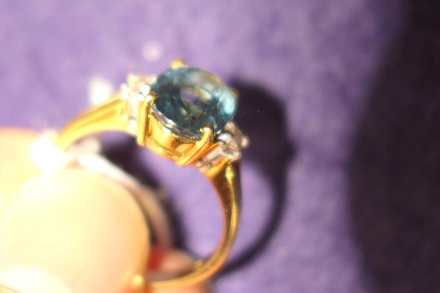 Diamond and blue zircon dress ring, the central oval cut stone of approx. 3cts, bordered with four - Image 6 of 7