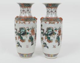 Matched pair of Chinese famille verte rouleau vases, 19th Century, decorated with figures at play in