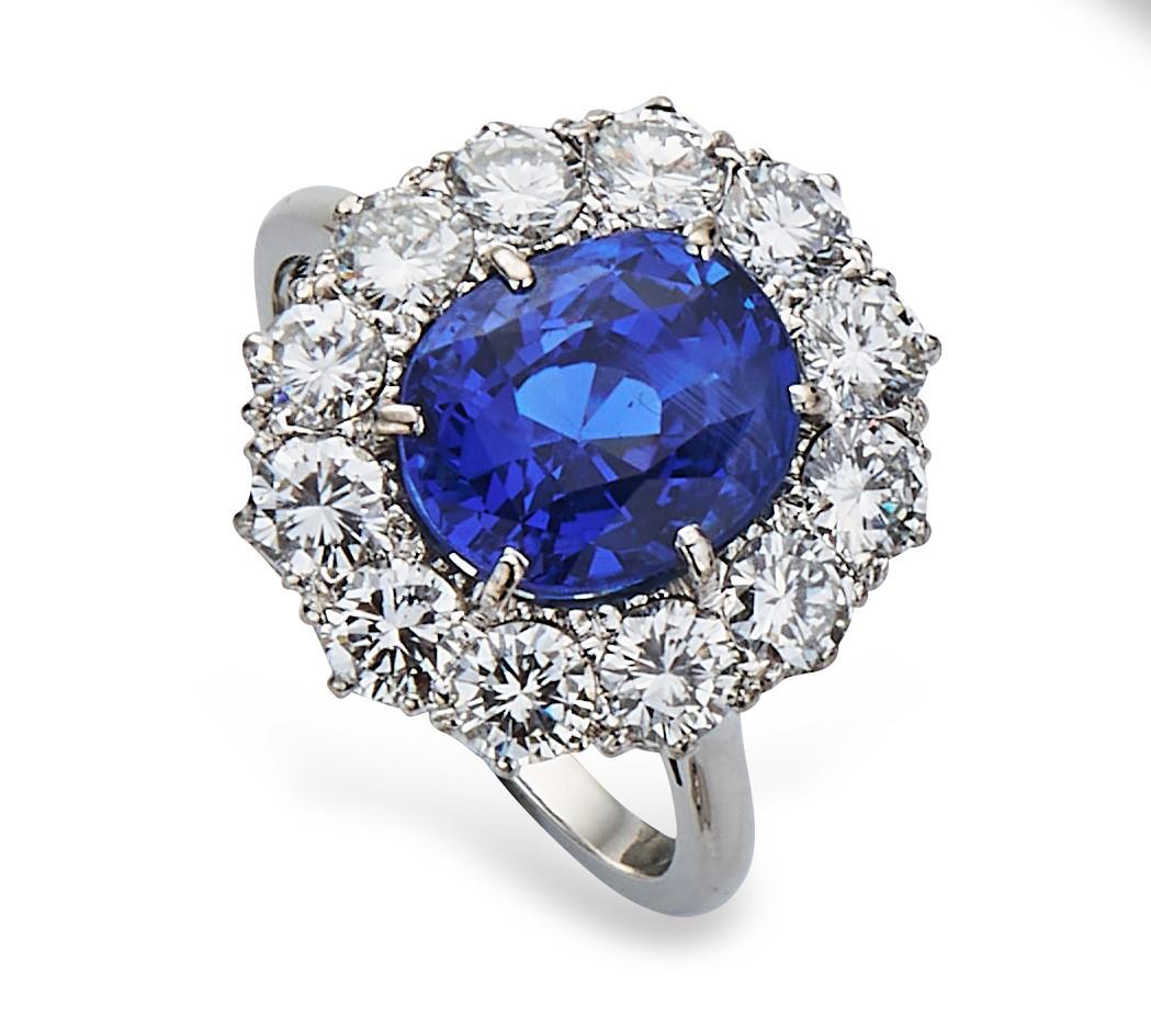 Fine sapphire and diamond cluster ring by Boodles, the mixed cushion cut natural sapphire