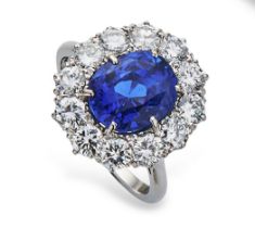 Fine sapphire and diamond cluster ring by Boodles, the mixed cushion cut natural sapphire