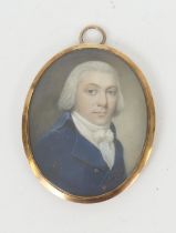 Regency portrait miniature of a gentleman, circa 1820-30, quarter length in a blue jacket, on ivory,