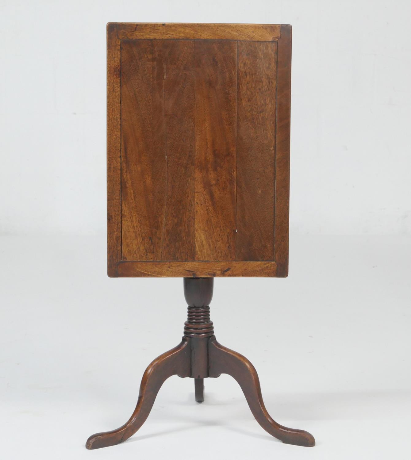 Provincial fruitwood tilt top tripod table, the rectangular top tilting over a turned urn column and