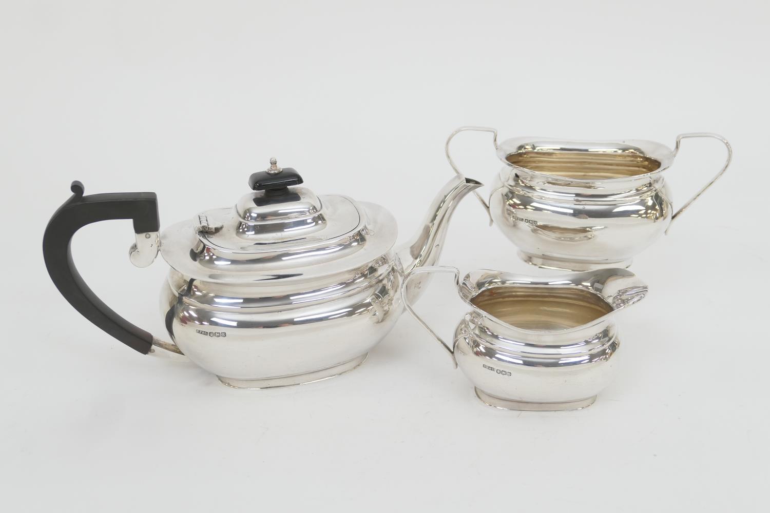 George VI silver three piece tea service, maker HF&Co., Sheffield 1940, comprising a bombe form