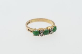 Cabochon jade and diamond ring, in 14ct yellow gold, three cabochon jades dispersed with four tiny