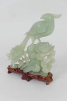 Chinese carved pale celadon jade table ornament, worked as a hawk and doves on a peony rock, 20th