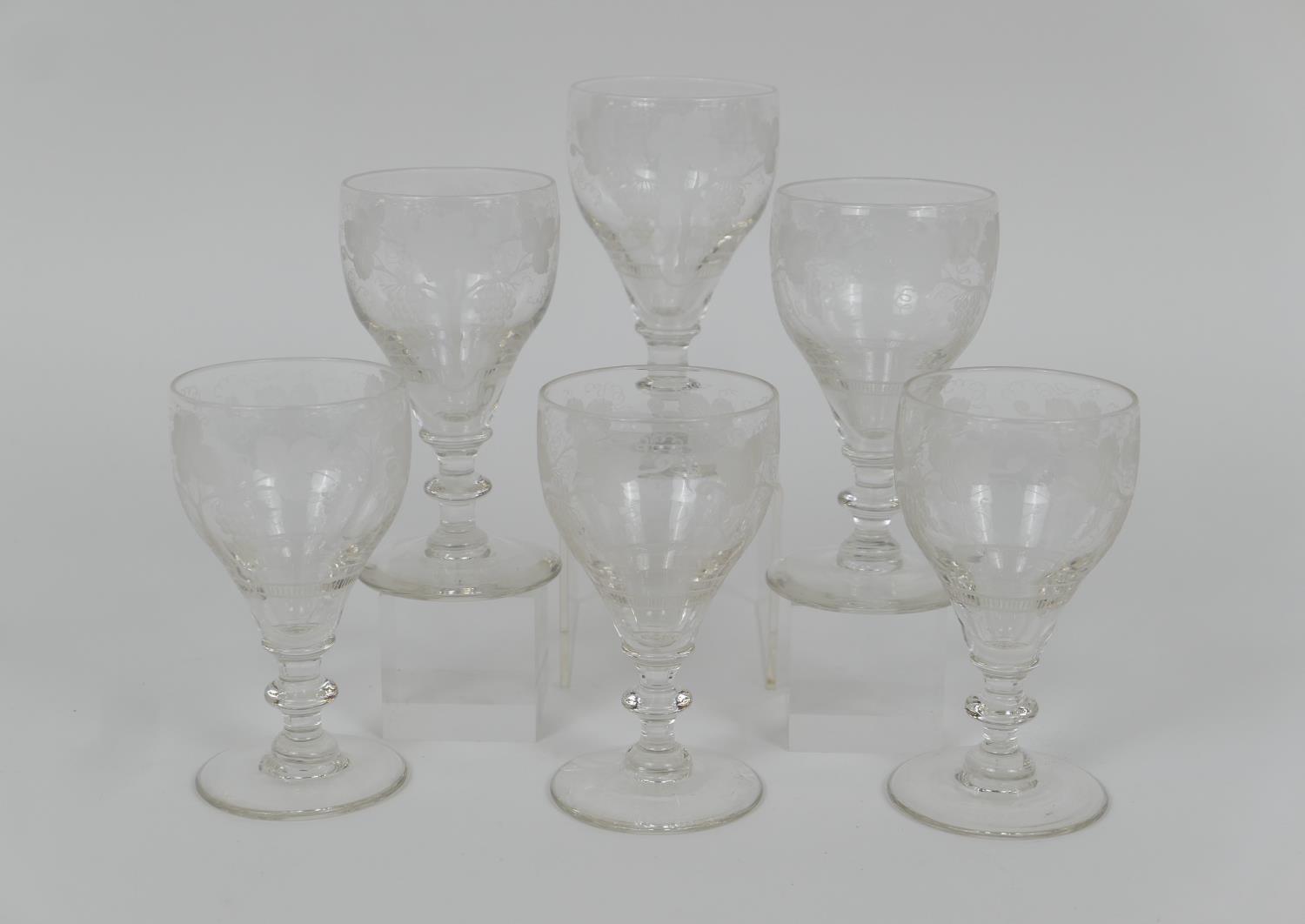 Set of six late Victorian wine glasses, each with ogee bowl engraved with fruiting vines and blade