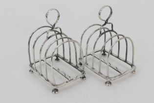 Pair of George V silver toast racks by Martin Hall & Co., Sheffield 1911, each with four