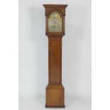 Provincial oak longcase clock, 12'' brass arched dial with silvered chapter ring and Old Father Time