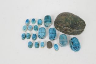 A small collection of Egyptian faience scarabs, the largest 8cm, the smallest 12mm (20) (Please note