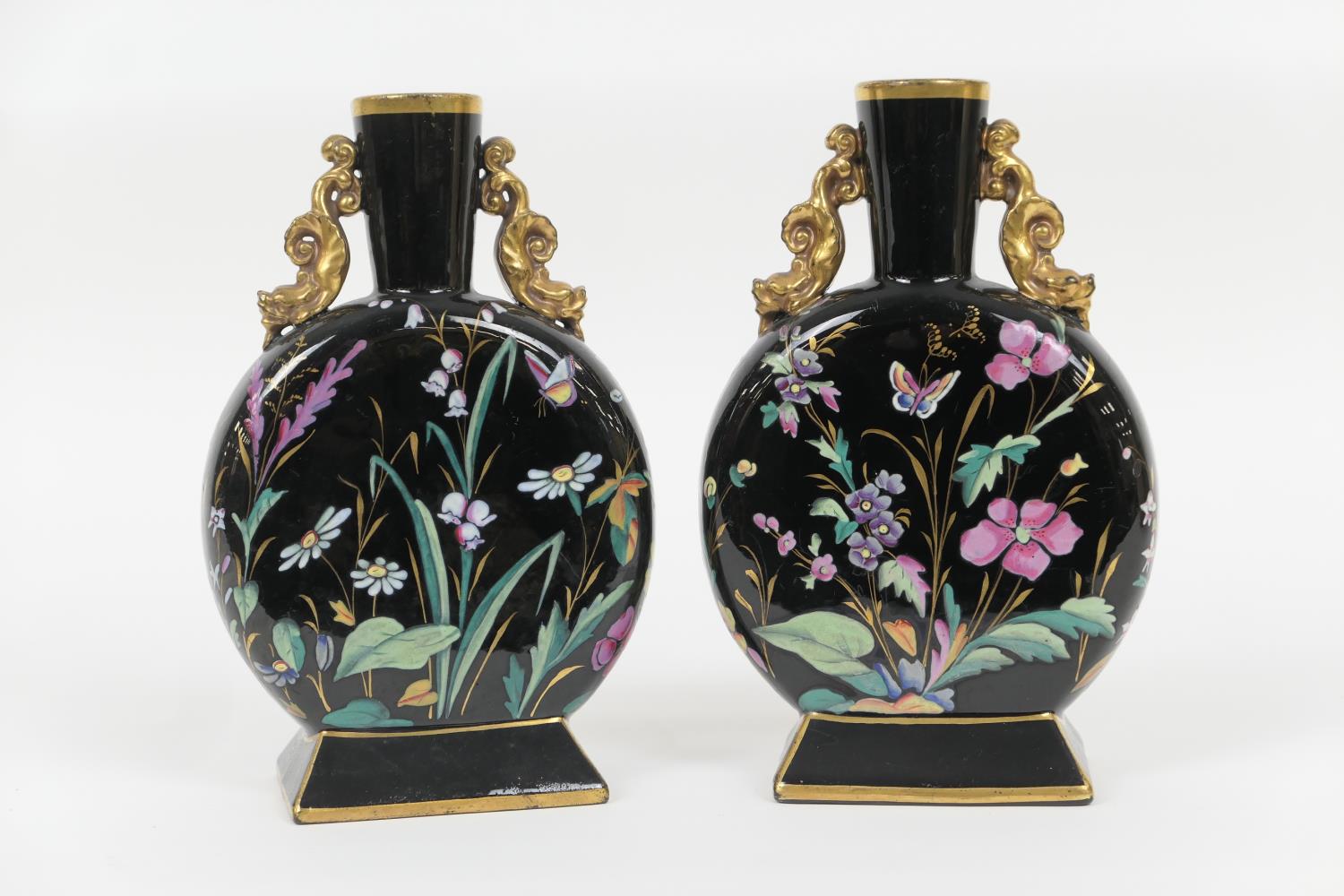 Pair of Victorian Aesthetic period moon flasks, circa 1880, enamelled with butterflies and wild