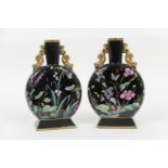 Pair of Victorian Aesthetic period moon flasks, circa 1880, enamelled with butterflies and wild