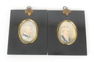 English School (mid 19th Century), Pair of portrait miniatures of a gentleman and his wife,