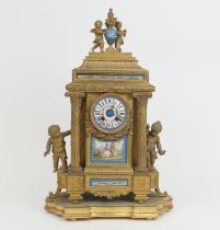 French gilt ormolu mantel clock, late 19th Century, surmounted with cherubs holding a flaming urn,