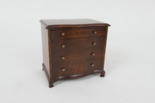 Unusual money box, worked as a miniature Georgian mahogany serpentine front chest of drawers '