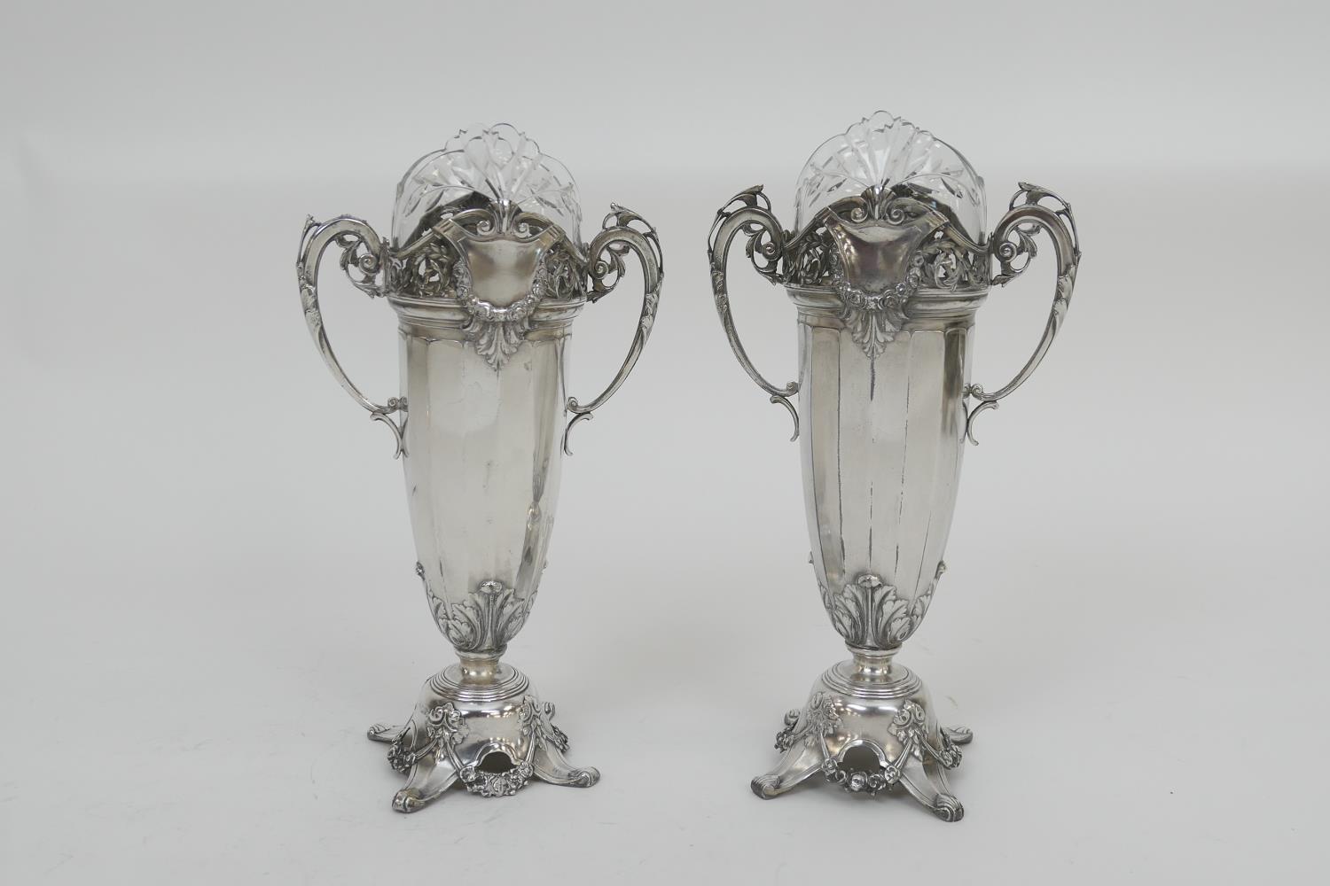 Pair of Kaiser silver plated vases, circa 1910, each having a cut and shaped glass liner, with