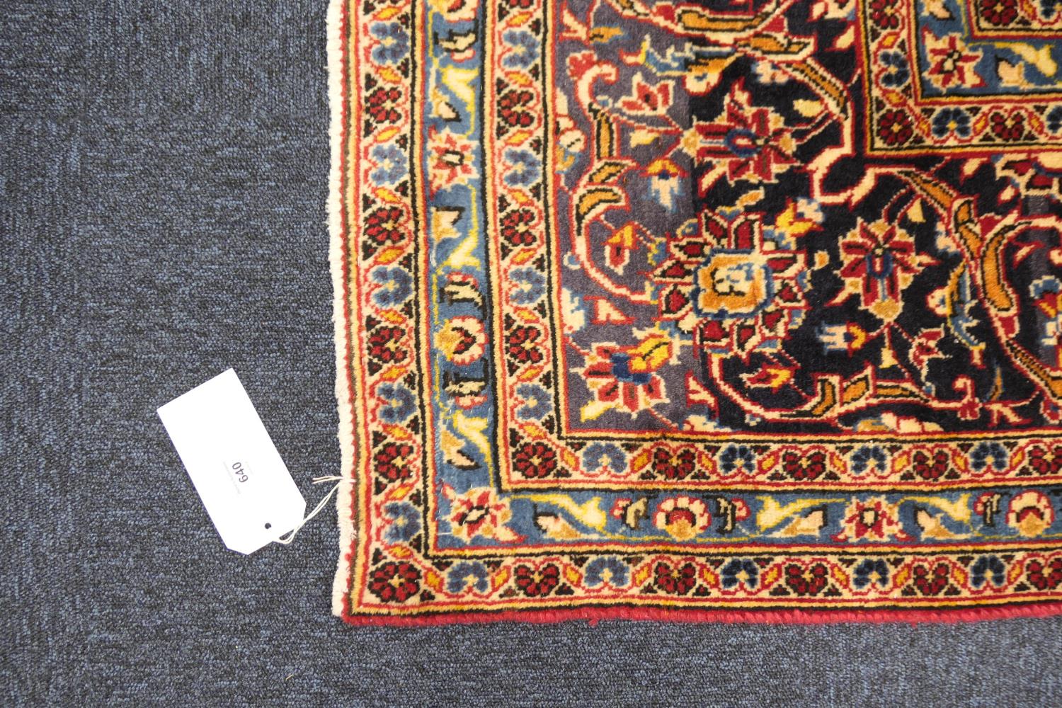 Kashan deep red ground woollen carpet, centred with a blue and fawn medallion, the field dispersed - Image 2 of 4