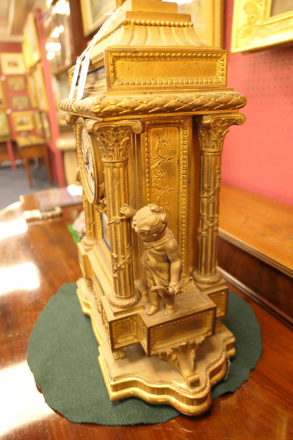 French gilt ormolu mantel clock, late 19th Century, surmounted with cherubs holding a flaming urn, - Image 3 of 4