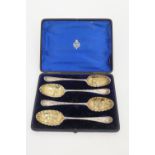 Cased set of four George III silver gilt 'berry' spoons, London 1771, later decoration, weight