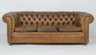 Brown leather upholstered chesterfield style settee, raised on bun feet, width 211cm, depth 90cm,