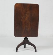 Mahogany tilt top tripod table, the rectangular top over a turned baluster column and three umbrella