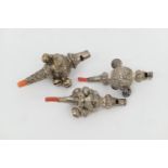 Three Victorian baby's silver rattles, comprising a whistle example with seven crotal bells and