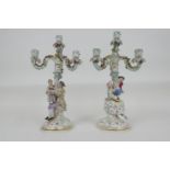 Pair of Meissen porcelain figural candelabra, 19th Century, each with three floral encrusted