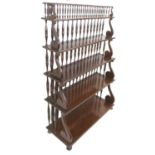 Colonial style hardwood waterfall bookcase, circa 1880-1900, having five tiered shelves united by
