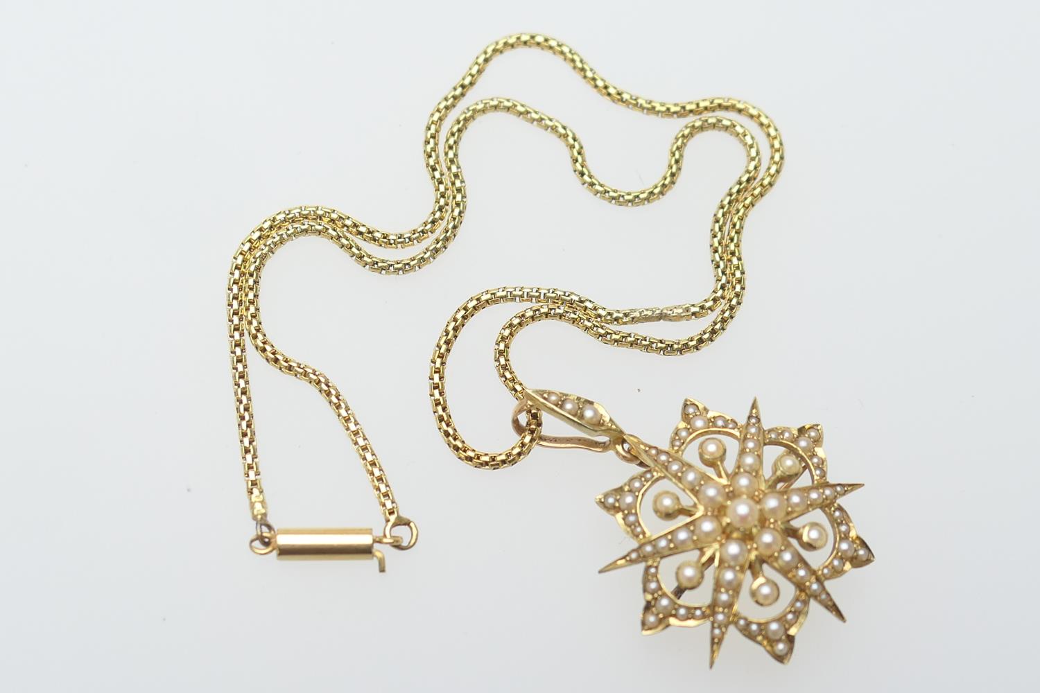 Victorian 15ct gold and pearl star pendant brooch, with loop for suspension, 35mm drop, width