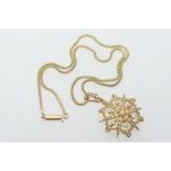 Victorian 15ct gold and pearl star pendant brooch, with loop for suspension, 35mm drop, width