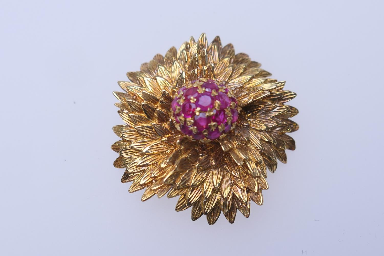 18ct gold and ruby chrysanthemum brooch, centred with a pistil of round cut rubies within a textured